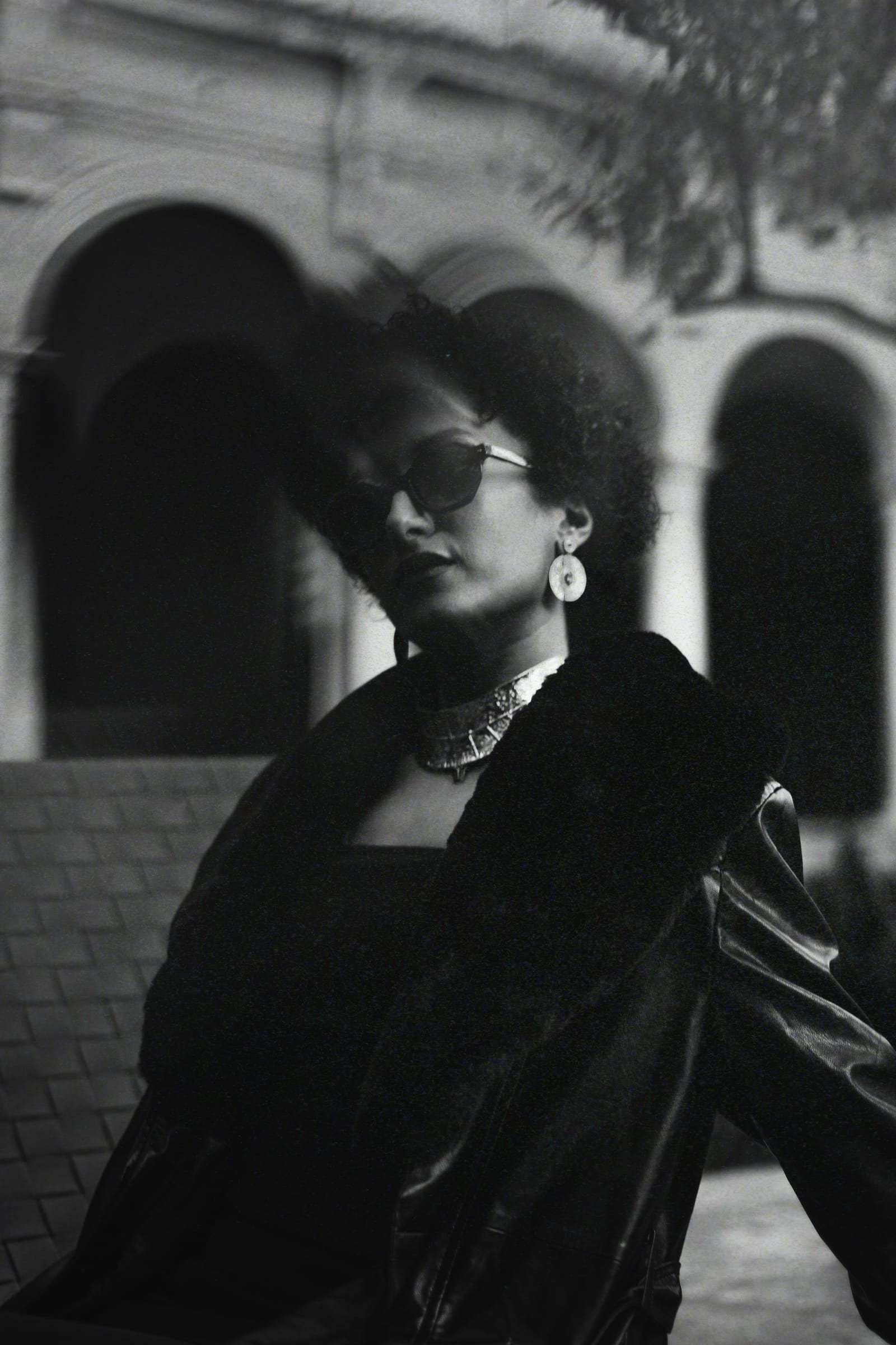 Editorial · B&W motion-blur over arches