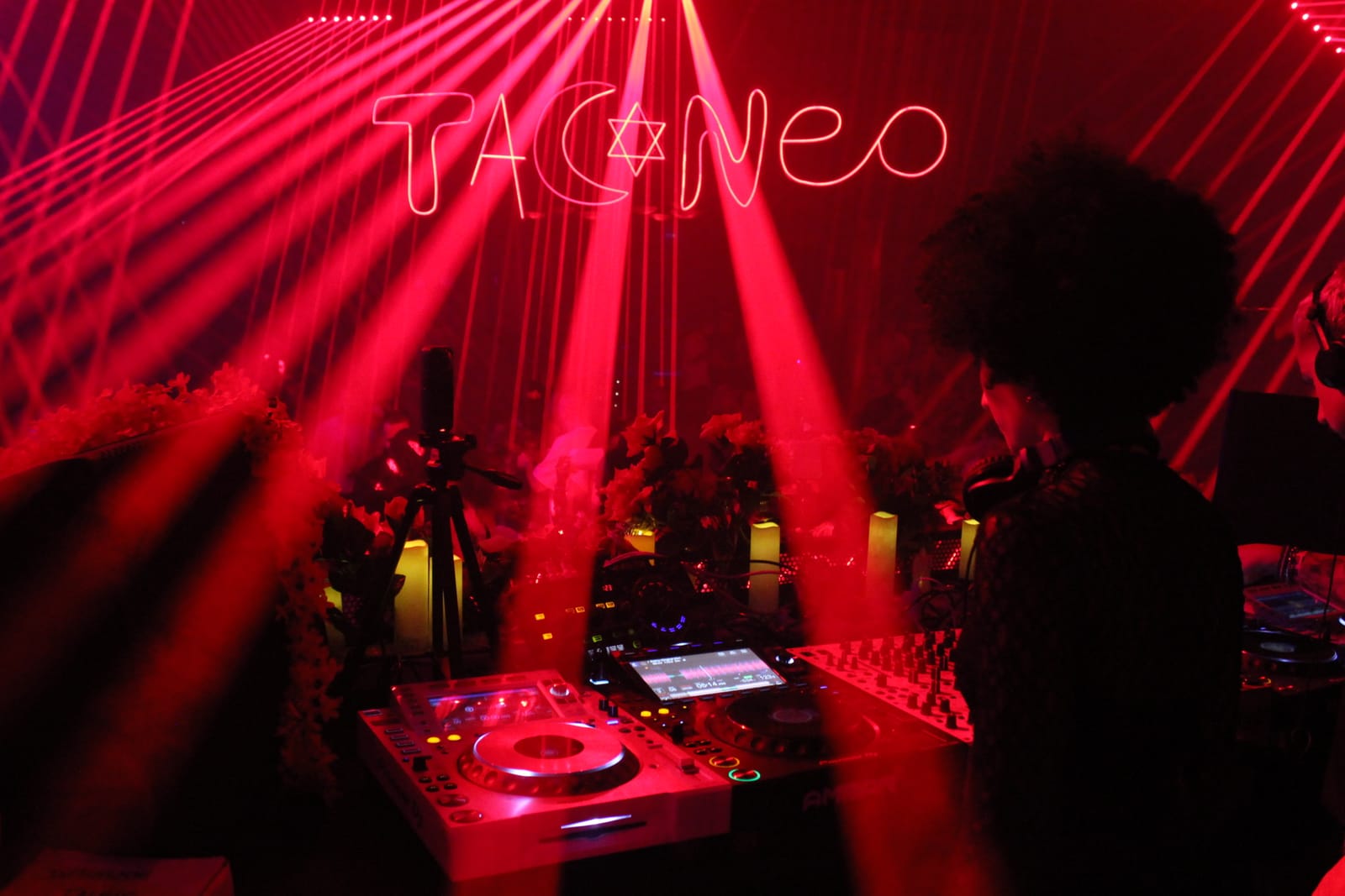 TACONEO laser show · DJ at decks